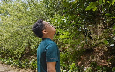 A man standing in the forest, solo travel, connecting with nature and him inner self, forest...