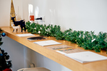 Festive shelf decor with greenery and reindeer figures