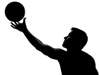 Silhouette of a Basketball Player: Dramatic, high-contrast silhouette captures a basketball player mid-action, perfectly balancing the ball above his outstretched hand.