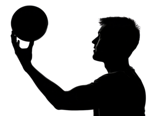 Basketball Silhouette: A dramatic silhouette of a male basketball player poised to shoot, his focus intense, conveying power, skill, and determination.
