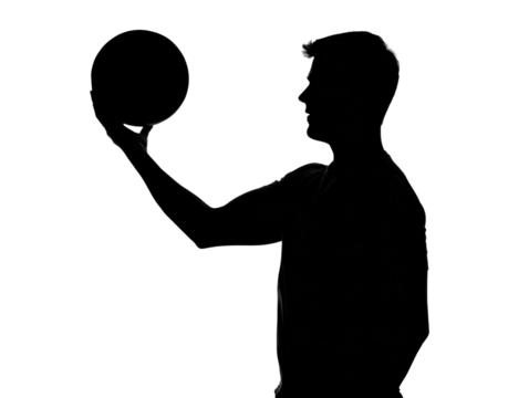 Silhouette Basketball Action: The silhouette of a basketball player poised, focused on the game, a symbol of athleticism, competition, and skill.