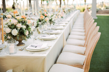 Romantic floral wedding arch decorated with roses and greenery