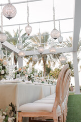 Outdoor wedding floral decorations with white roses and greenery