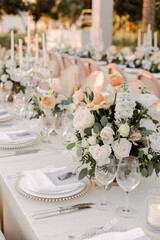 Romantic floral centerpiece with pastel roses and white flowers