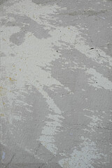 Peinture grise écaillée sur un mur