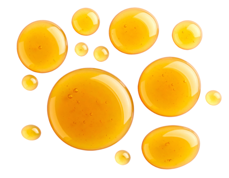 realistic honey droplets floating like planets on isolated background for sweet food design and natural ingredient concept

