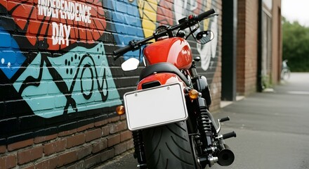 Red motorcycle parked by colorful graffiti wall with brick texture and neutral background. The rear view highlights the bike's details with an empty license plate.