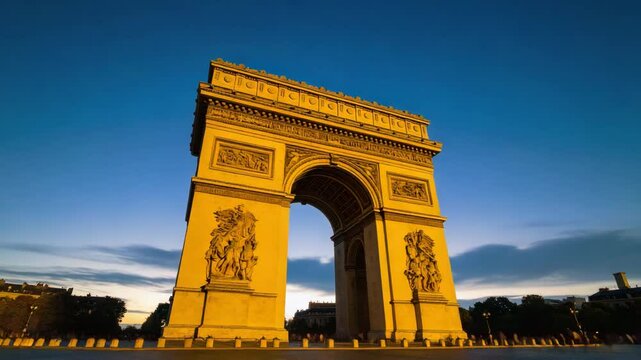 Majestic arc de triomphe in paris illuminated at night with city lights and starry sky above