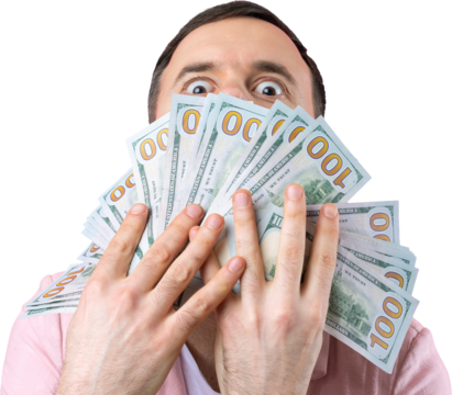 Portrait of a contented young businessman with a beard dressed in a pink jacket showing us dollar banknotes against a isolated studio background. Taste, smell of money.