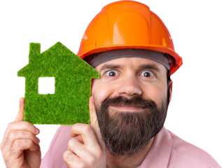 Portrait of young construction engineer wear orange hard hat, in a pink jacket standing on isolated studio background. A man holds a green eco house.