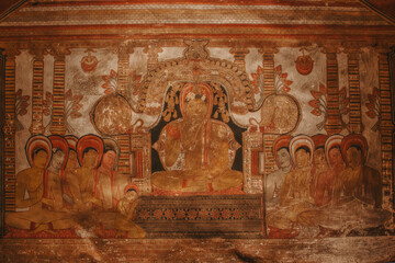 Buddha with his disciples cave paintings at Rangiri Dambulla Royal Cave Temple, Dambulla, Sri Lanka.