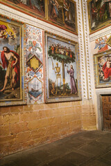 Segovia, Spain - 3 March, 2025: Allegorical painting of Jesus and a skeleton chopping down the Tree of Life, memento mori, Segovia Cathedral, Spain