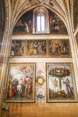 Segovia, Spain - 3 March, 2025: Allegorical painting of Jesus and a skeleton chopping down the Tree of Life, memento mori, Segovia Cathedral, Spain