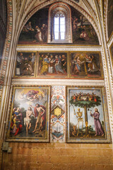 Segovia, Spain - 3 March, 2025: Allegorical painting of Jesus and a skeleton chopping down the Tree of Life, memento mori, Segovia Cathedral, Spain