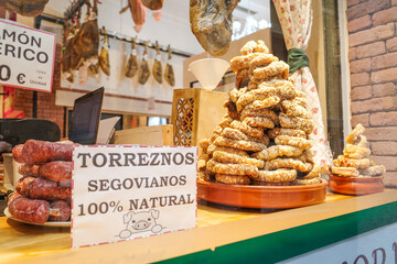 Segovia, Spain - 3 March, 2025: Torreznos, a delicious fried pork belly snack, on sale at a butchers shop in Segovia
