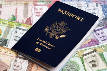 American passport on Saudi riyal