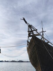 a coastal child who jumped from a traditional boat made of wood