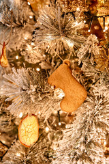 Festive christmas tree adorned with gingerbread and dried orange ornaments