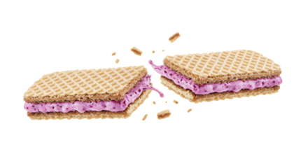 A delicious crispy wafer cookie filled with pink berry cream breaks in half, revealing a smooth, sweet filling with berry bits.