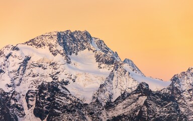 Majestic Snow-Capped Mountain Peak at Sunrise: Breathtaking Alpine Landscape Photography