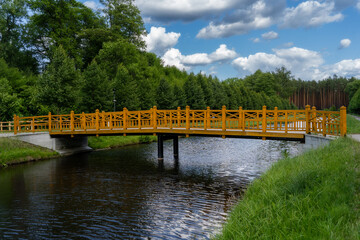 Zwierzyniec Park in Roztocze, Lubelskie offers peaceful paths and a beautiful wooden bridge set among forests – a must-see Polish nature destination