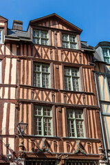 Historic half-timbered houses showcase architectural beauty in Rouen, France on a clear sunny day