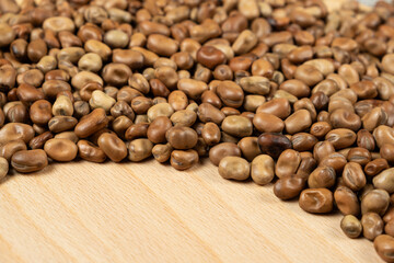 Whole dried raw uncooked vicia faba beans close-up