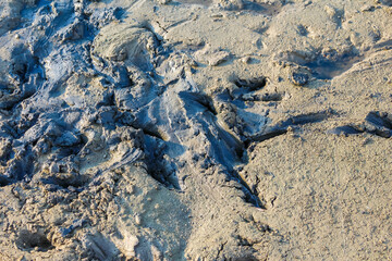 High altitude aerial view of rocky mountain landscape with carved valleys and ridges