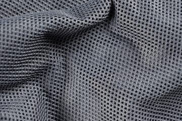 Synthetic polyester fabric macro top view, gray fabric background