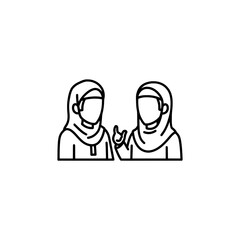Obraz premium Two women wearing hijabs engaging in conversation