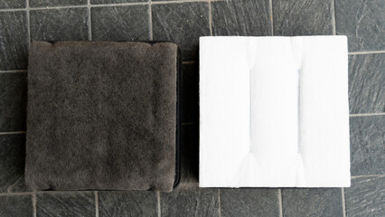 Backside of old and new filters. Comparison between new and old is different. Placed on a black...