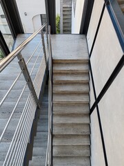 Detail of a modern structure with steel and travertine stairs