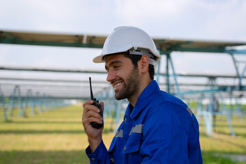 Engineers are working at solar farm.