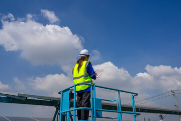 Engineers are working at solar farm.