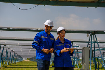 Engineers are working at solar farm.