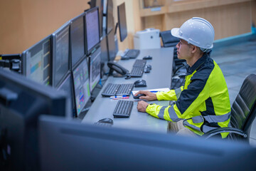 Engineer working at control room, Manager control system, Technician man monitoring program from a...