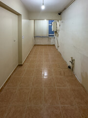 Istanbul, Turkiye, May 1, 2025. Empty Kitchen Interior Before Renovation with Tiled Floor and Gas Installation