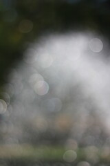 An abstract view of water streaming from a fountain.