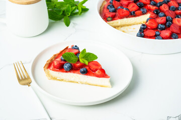 Tart with strawberry and blueberry and cream cheese. Homemade baking.