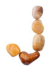 letter J is made of stone with a white background. The creative shapes of the letters of the alphabet are arranged with stones.