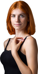 Cute red-haired girl, studio portrait on a black background.