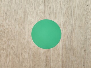 Plywood texture, green circle sheet on plywood, circle shaped sheet on plywood, plywood, simple...