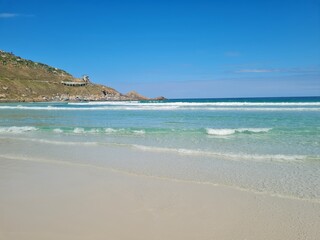Praia Grande (Big Beach) Arraial do Cabo, Rio de Janeiro - Brazil: sunny morning, coastal atmosphere of the winter, white sand and crystal-clear blue waters in Brazilian Caribbean.