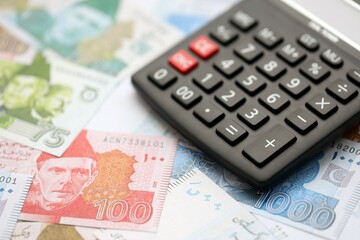 Pakistan rupees banknotes and calculator. The current Pakistan money bills with calculator