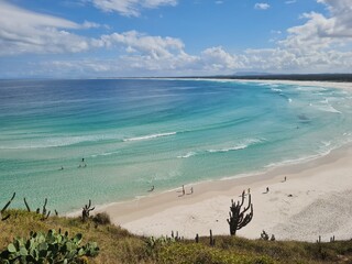 Praia Grande (Big Beach) Arraial do Cabo, Rio de Janeiro - Brazil: sunny morning, coastal atmosphere of the winter, white sand and crystal-clear blue waters in Brazilian Caribbean.