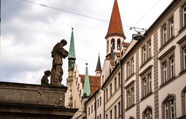 Historic Toy Museum In Munich Near Marienplatz: Old Tower With Red Roof And Green Spire Framed By...
