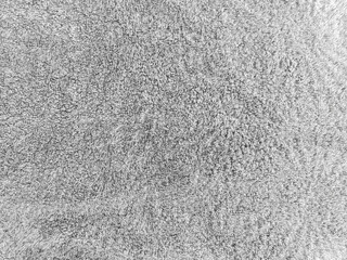 Fototapeta premium gray shower towel texture. Fluffy carpet background. Blank bathroom textile. Warm sweater natural material. Soft baby fabric backdrop detail. Grey flat surface. Home canvas design