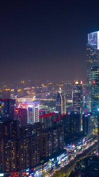 flight over guangzhou city traffic riverside downtown night illumination aerial timelapse vertical panorama 4k china