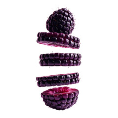 Stacked purple fruit pieces against black background