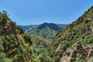 Mountain landscape with scythian warrior monument in Turgen gorge, Kazakhstan